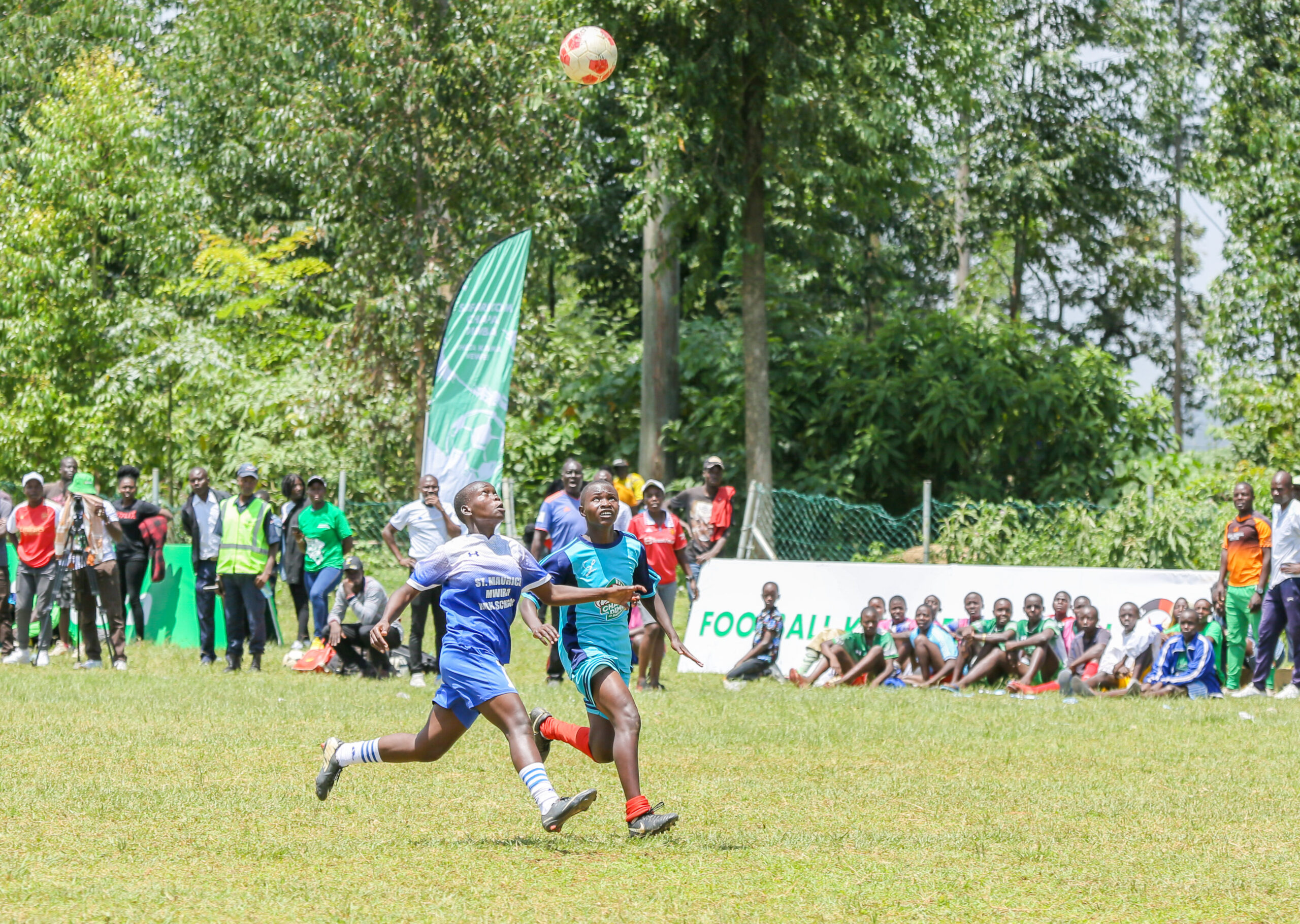 In an exciting Safaricom Chapa Dimba Kakamega County final held on Saturday at Kakamega High School Grounds, The Menace FC staged a remarkable comeback from being two goals down to secure a victory against Lugusi Boys. During the first half, Lugusi Boys asserted their dominance, surging ahead with a two-goal lead, courtesy of a splendid strike by Donald Omarai in the 30th minute and a clinical finish from Rover Shikuku in the 35th min. The performance displayed by Mance FC in the second half was nothing short of exceptional. They had an impressive comeback, orchestrated by a brace from the super-talented striker Sharrif Muramba, in the 57th and 74th minutes to force the match into a 2-2 draw in the regular time. The Menace went ahead to edge out Lugusi Boys, 5-4 on penalties. The Menace goalkeeper, Ignatius Onyango, saved 1 penalty to earn them the sweet victory. They head to the western regional finals scheduled for the 26th -27th at Bukhungu Stadium. Speaking after winning, the excited Coach Dismas Wanjawa of The Manace praised his team for keeping hope alive and fighting hard to bounce back to win the county title. “My boys have surprised everyone today. We went for the halftime two goals down but I am glad they did not lose hope instead, they kept the spirit high and battled it out squarely in the second half to emerge victorious through penalties,” said Dismas Wanjawa, Coach of The Menace FC. Lugusi’s fans, who had turned out in large numbers, believe the boys displayed a good game against their competitors, who capitalized on all their chances in the second half to enable them to claim the victory through penalties. Meanwhile, In the Girls’ category between, the reigning champions Lugari Progressive beat Kakamega Starlets 4-0 in the first half of the game. Linda Achieng opened the scoresheet in the 1st minute of the game before Marion Musanga doubled the score in the 9th minute. Elizabeth Mideva, scored twice in the 25th and 29th minute to silence the unsettled Kakamega Starlets. “We are the reigning Champions of this region and hope to retain the title. The game was really good, we had good teamwork that helped us to win. We thank our coach Mr. Fred for his tactical coaching skills and support and our fans for coming out in large numbers, and we ask them to also come in large numbers in the regional finals games,” Said Marion Musanga, Player at Lugari Progressive Each of the winning teams took home KES 75,000 cash Prize, with the runners-up Lugusi Boys and Kakamega Starlets pocketing KES 30,000 each. The top scorers and Best Goalkeepers each took home KES. 10,000 with the Most Valuable Players (Golden Ball) from both the boys’ and girls’ teams, each receiving a similar amount and the TVET scholarships courtesy of the Safaricom and M-PESA Foundations. The Manace will battle it out with John Osogo from Busia, Compel Sportiff from Bungoma and Ebwali Boys from Vihiga in the boys category. Lugari Progressive now prepares to face Chakol Queens, Brenda Girls and Madira Soccer Assassins in the girls’ category in the coming regional finals. This year, Western Kenya registered a total of 441 teams participating in the tournament with Kakamega leading at 162, followed by Bungoma (152), Busia (64), and Vihiga (63). Safaricom Chapa Dimba aims to provide a structured platform for scouts and coaches to tap into new talent and build feeder systems for the Kenyan football leagues across the country while also training a total of 250 coaches. The football tournament targets young people aged between 16 and 20 years old.